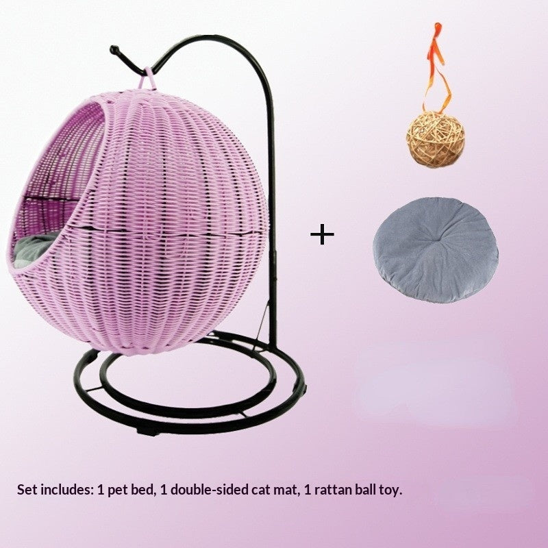 Removable & Washable Hanging Basket Hammock Style Pet Bed with pink basket, grey mat, and rattan ball toy.