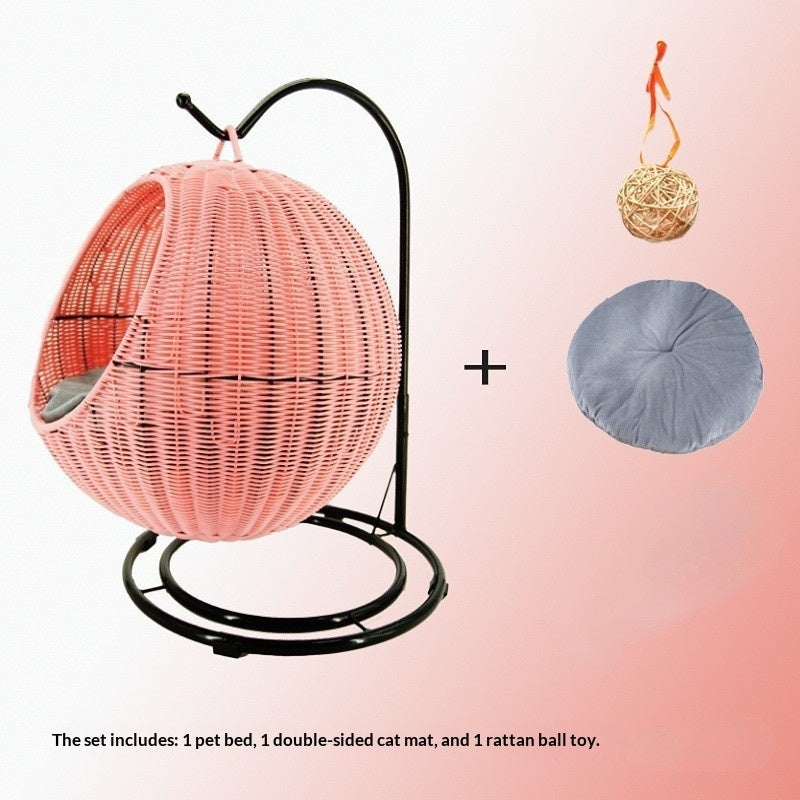 Removable & Washable Hanging Basket Hammock Style Pet Bed with pink rattan design, gray cushion, and hanging ball toy.